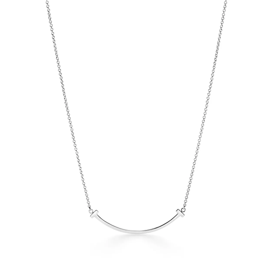 Zerra Jewelry Tiffany T Smile Pendant Small necklace with a sleek gold design featuring the iconic Tiffany T logo charm.