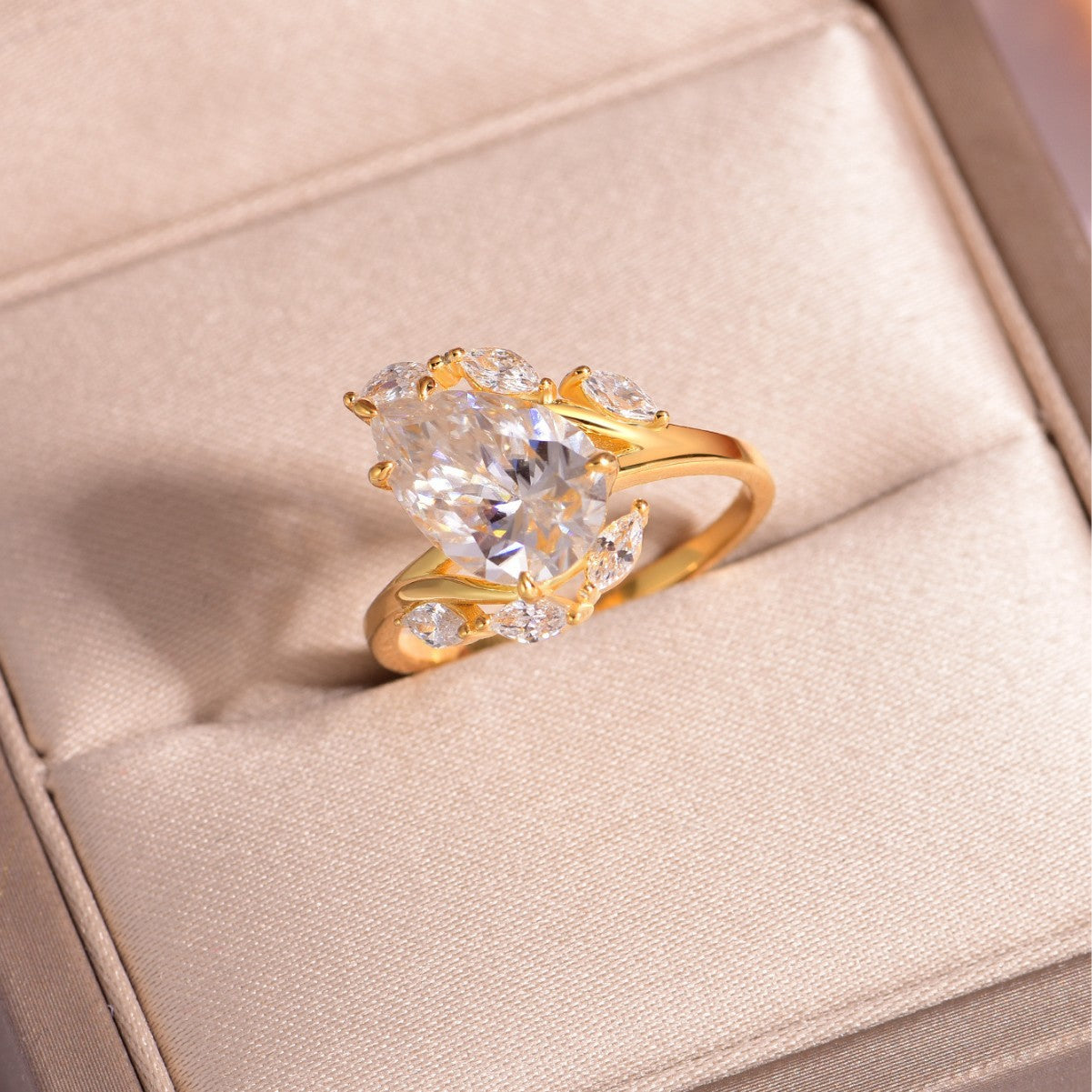 Yellow gold round corolla ring on soft romantic background. Alt: “4CT Corolla Moissanite Ring – Round – 18K Yellow Gold.”