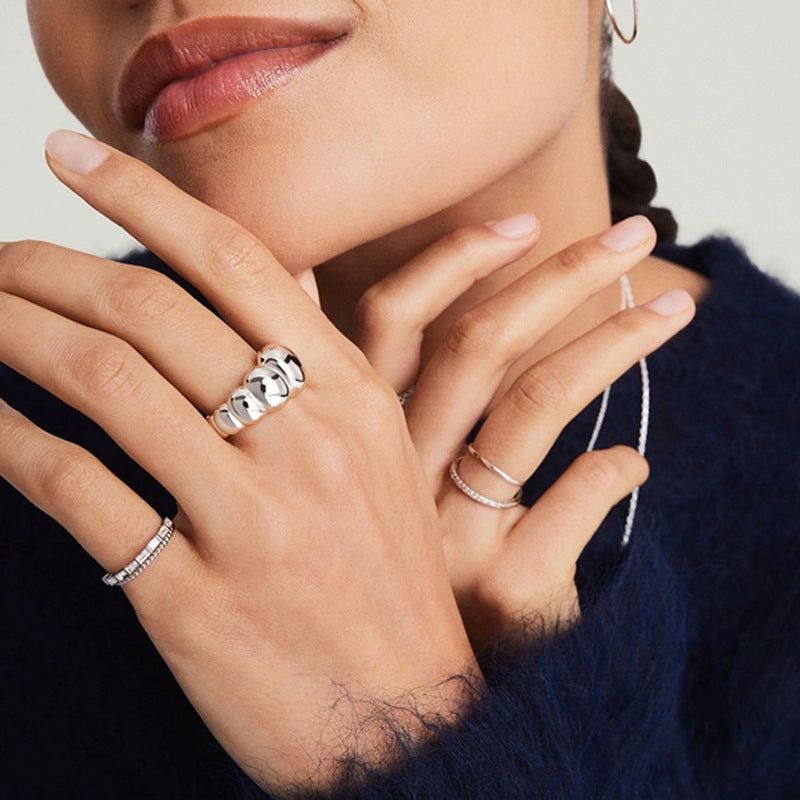 “Model wearing bold geometric dome ring in sterling silver”