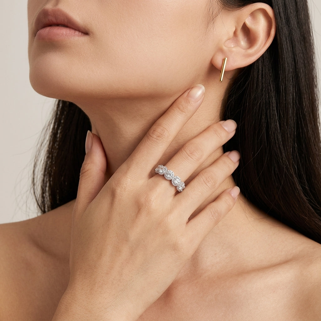 Model holding hand near neck showing 4ctw round diamond micro-pave halo eternity band.