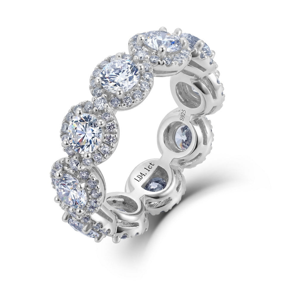 Angled side view of 4ctw round diamond halo eternity ring showing gallery architecture.