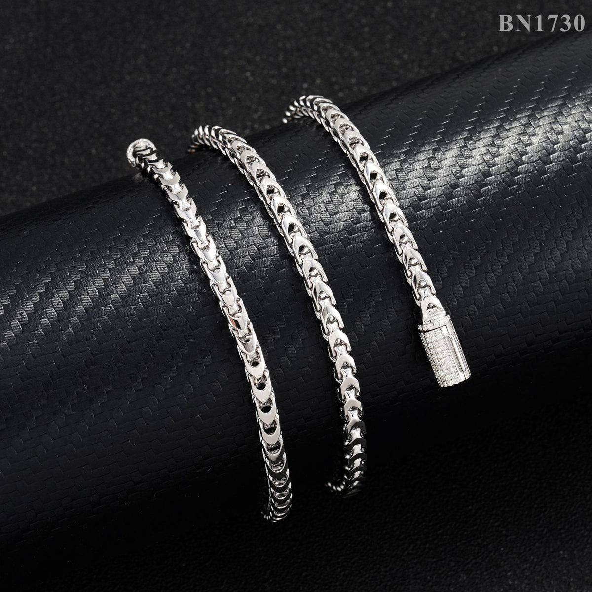 Gold, silver, and rose gold 4mm franco chain necklaces aligned on jewelry display tray