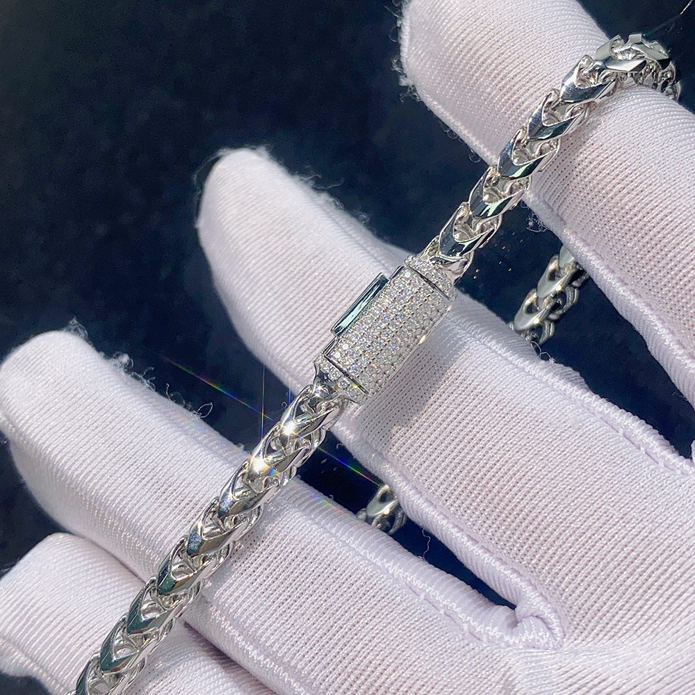 Gloved hand holding 4mm silver franco chain necklace showing pave iced out moissanite box clasp detail