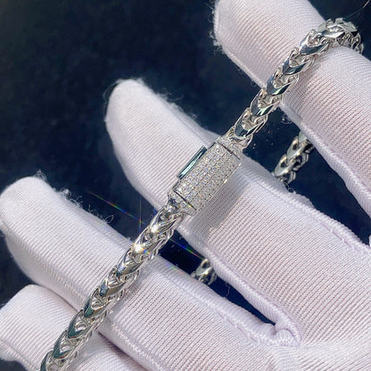 Gloved hand holding 4mm silver franco chain necklace showing pave iced out moissanite box clasp detail