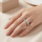 Full hand shot of model wearing 5.17ctw round cut side pave eternity ring.