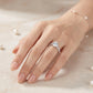 Close-up view of a woman's hand showcasing the sparkling 6-prong round cut moissanite solitaire ring.
