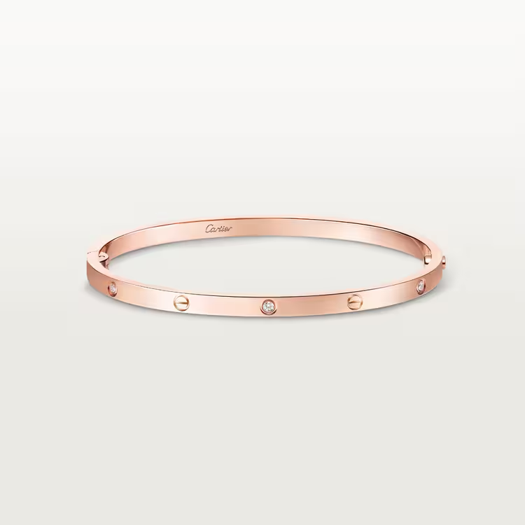 Zerra Jewelry Cartier LOVE bracelet, small size with 6 diamonds, gold bangle with signature screw detail on a white background