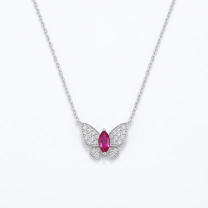 White background front view of a 925 sterling silver marquise ruby butterfly necklace on a delicate fine cable chain.