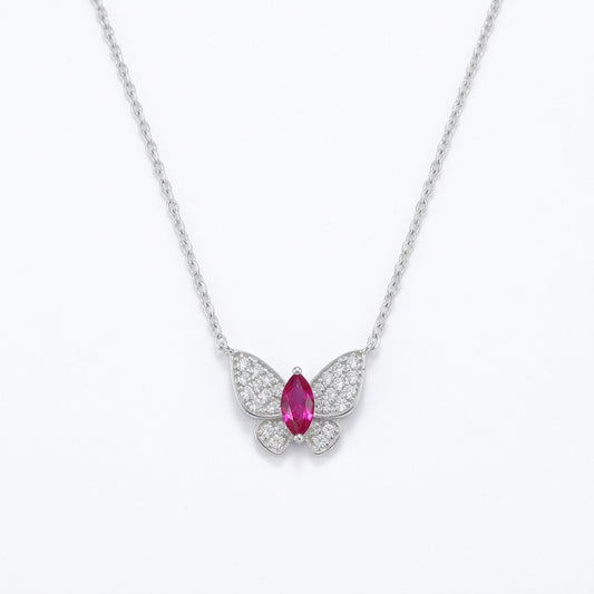 White background front view of a 925 sterling silver marquise ruby butterfly necklace on a delicate fine cable chain.