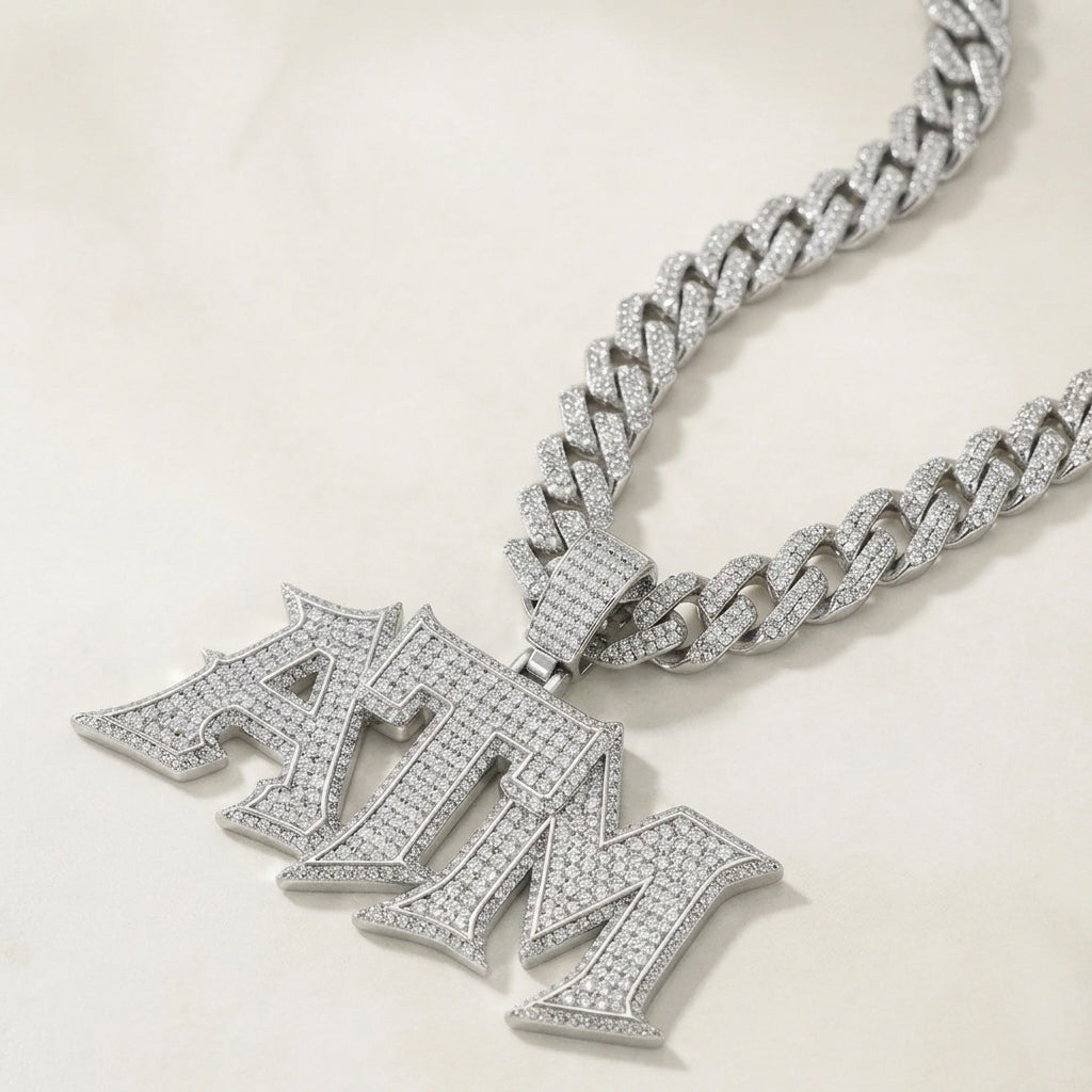 Studio micro close-up displaying 925 sterling silver iced out ATM letter pendant with full micro pave moissanite stones.