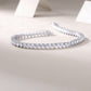  “Stackable Gold Luxury: Moissanite Tennis Bracelet.”