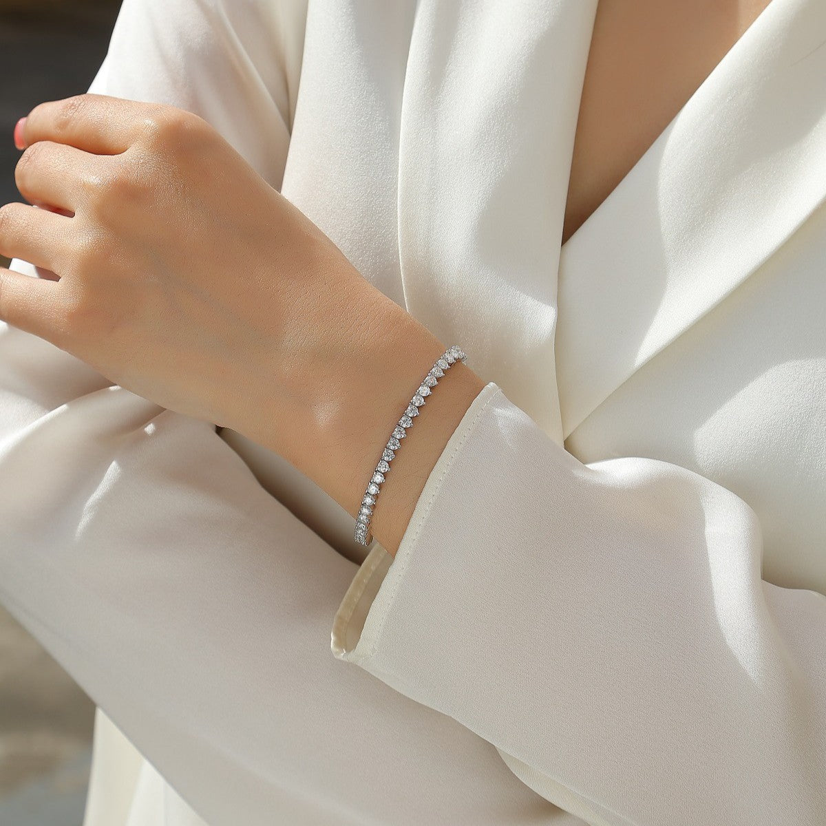 Bracelet styled with evening or bridal attire. Alt: “Warm Elegance: Styling Gold Moissanite Bracelet.”