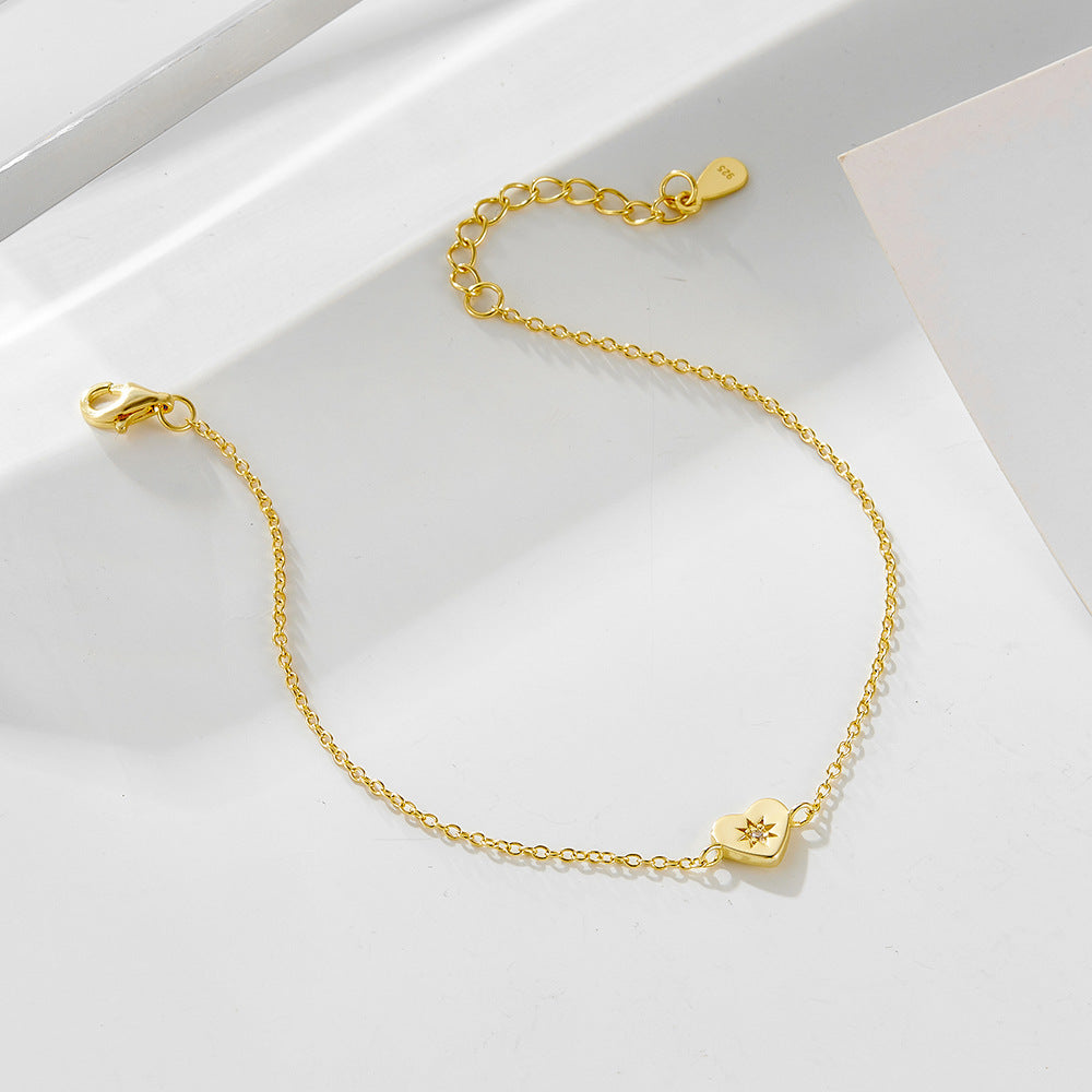 Close-up of Heart Charm and Gold Plating Texture