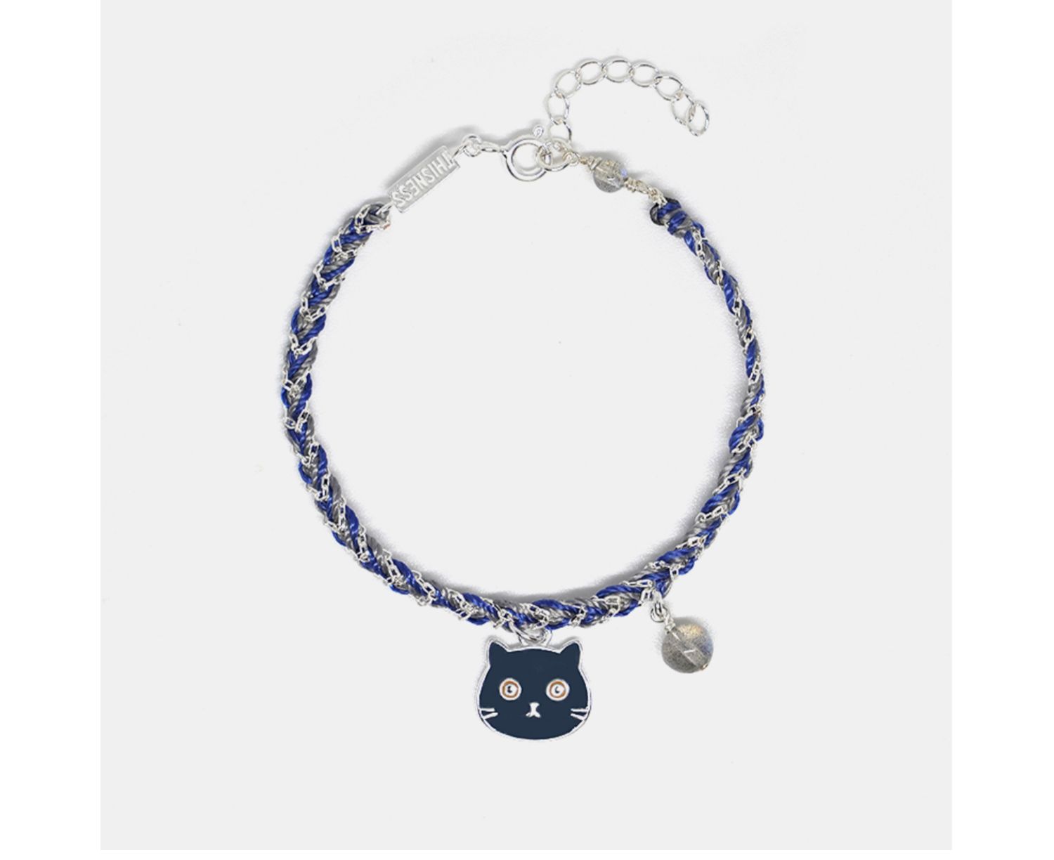Bracelet with a cat charm and blue beads on a white background