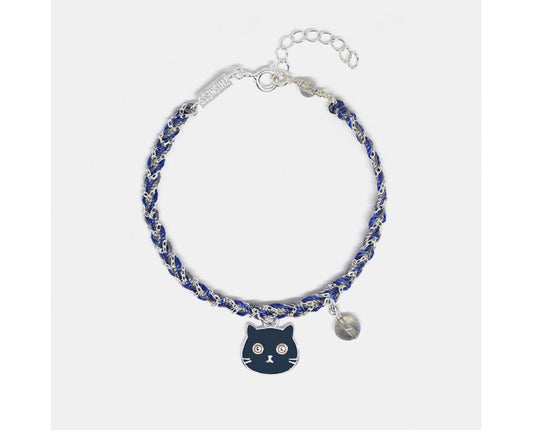 Bracelet with a cat charm and blue beads on a white background