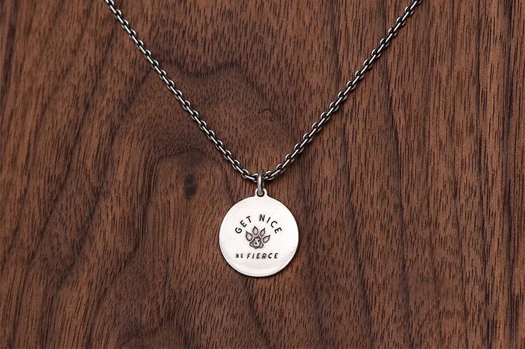 “Engraving detail on sterling silver cat tag pendant custom jewelry”