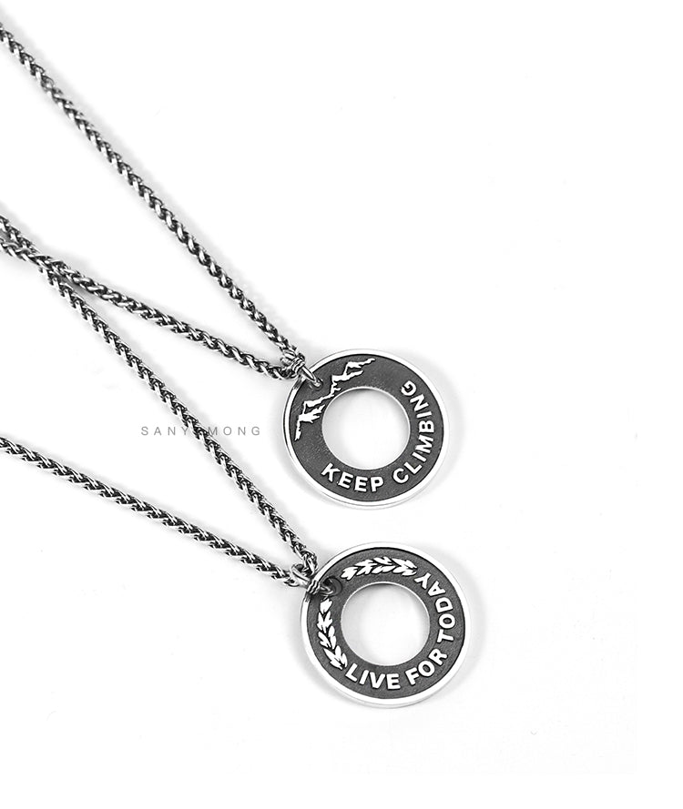 “Close-up of hollow-carved dragon bone round pendant in 925 silver”