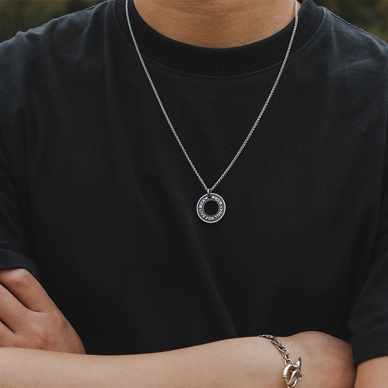“Male model wearing dragon bone round medallion necklace streetwear style”