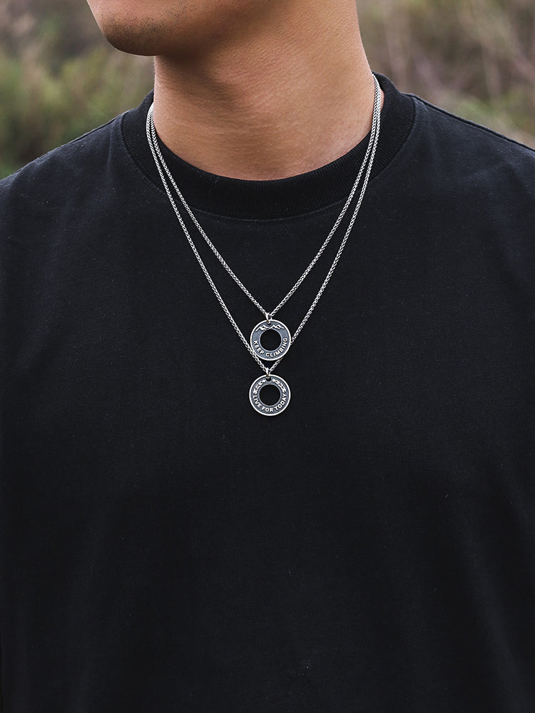 “Male model wearing dragon bone round medallion necklace streetwear style”