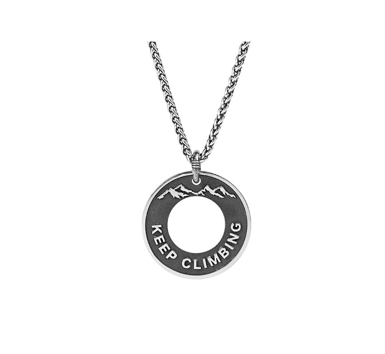 “Sterling silver dragon bone medallion necklace flat lay photo”