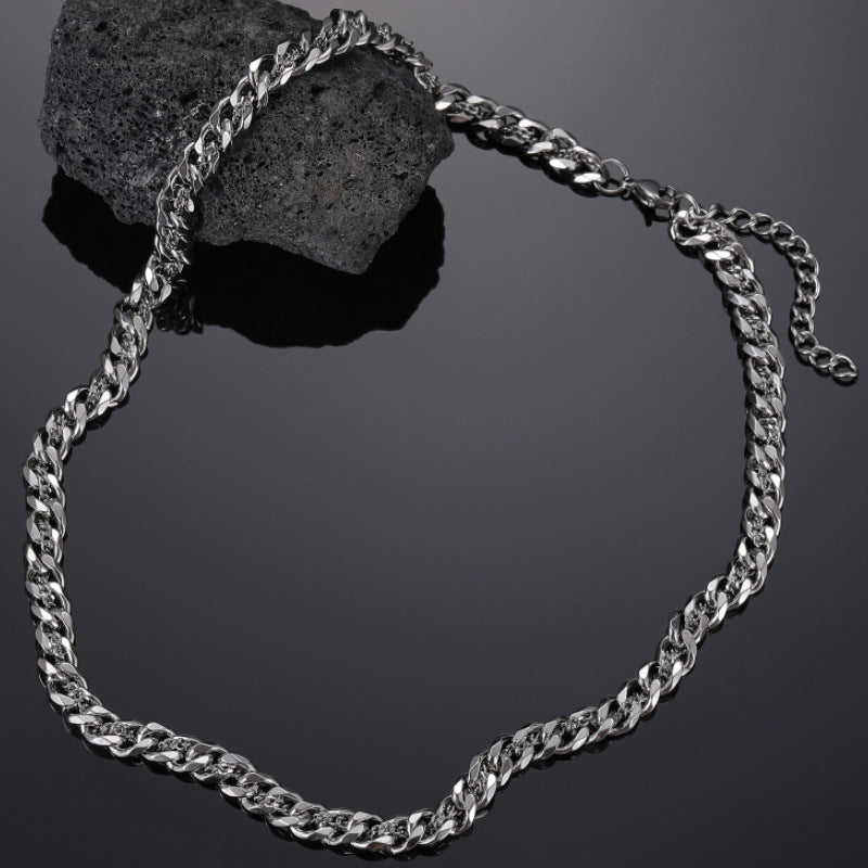 “Dual-layer 925 sterling silver Cuban chain with hidden gold accents – flat lay product view”