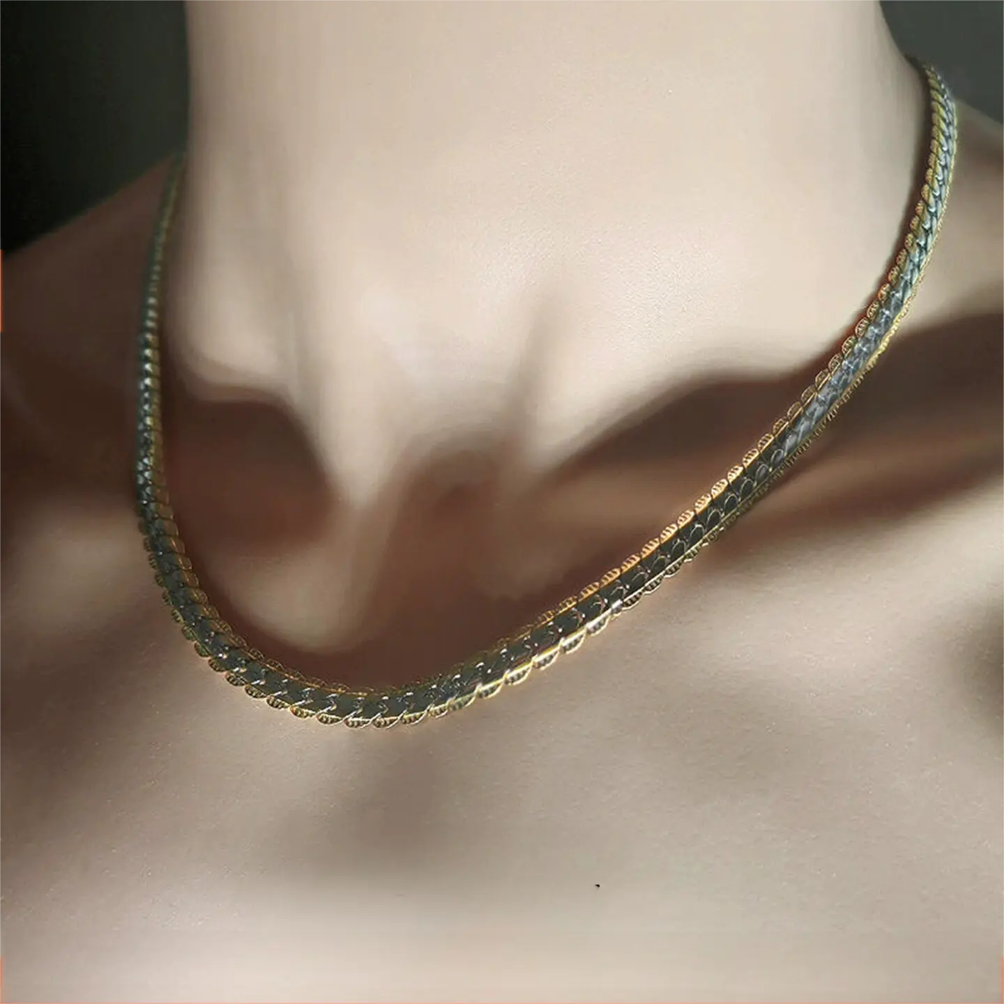 “Dual-layer 925 sterling silver Cuban chain with hidden gold accents – flat lay product view”