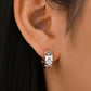  Earrings worn as everyday luck. Alt: “Lucky Sparkle: Clover Moissanite Earrings.”