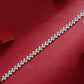  Macro of continuous heart-shaped moissanite stones. Alt: “Heart Moissanite Tennis Bracelet Detail.”