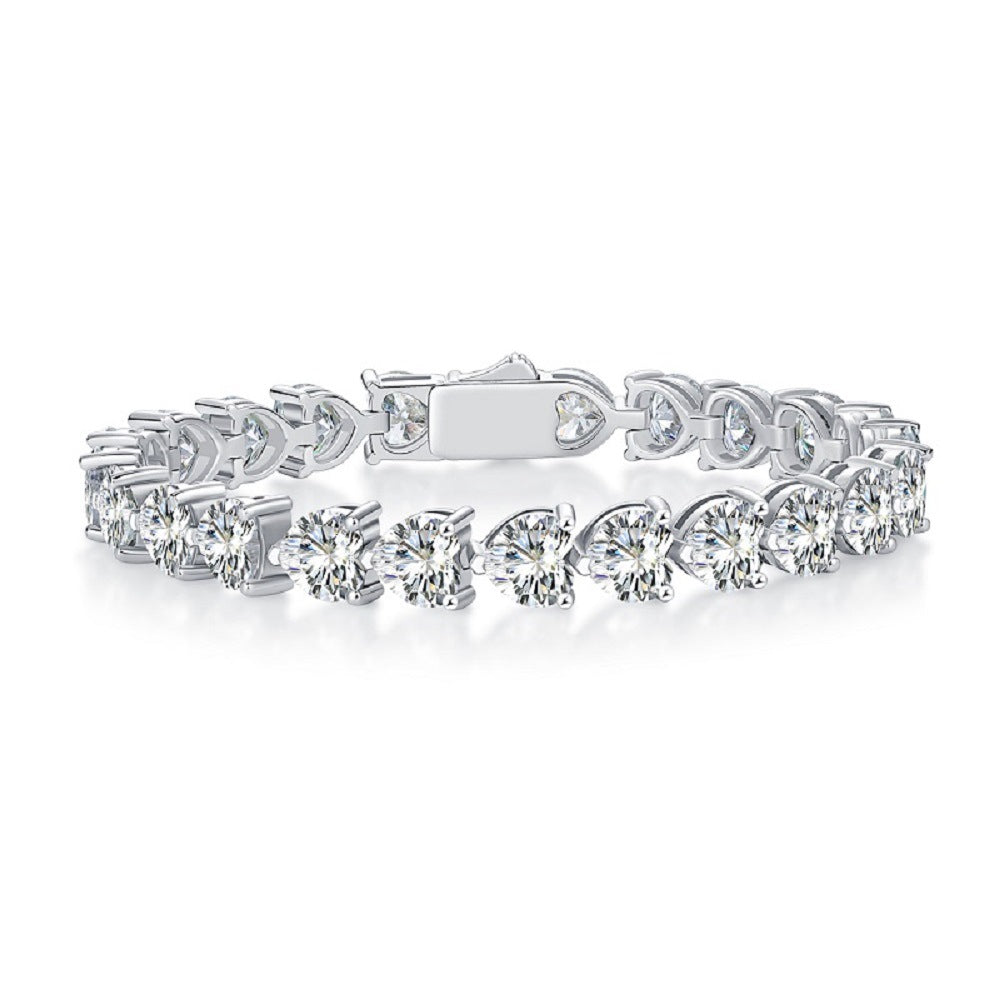 Bracelet styled with romantic or Valentine's accents. Alt: “Wear Your Heart: Styling Heart Cut Moissanite Bracelet.”