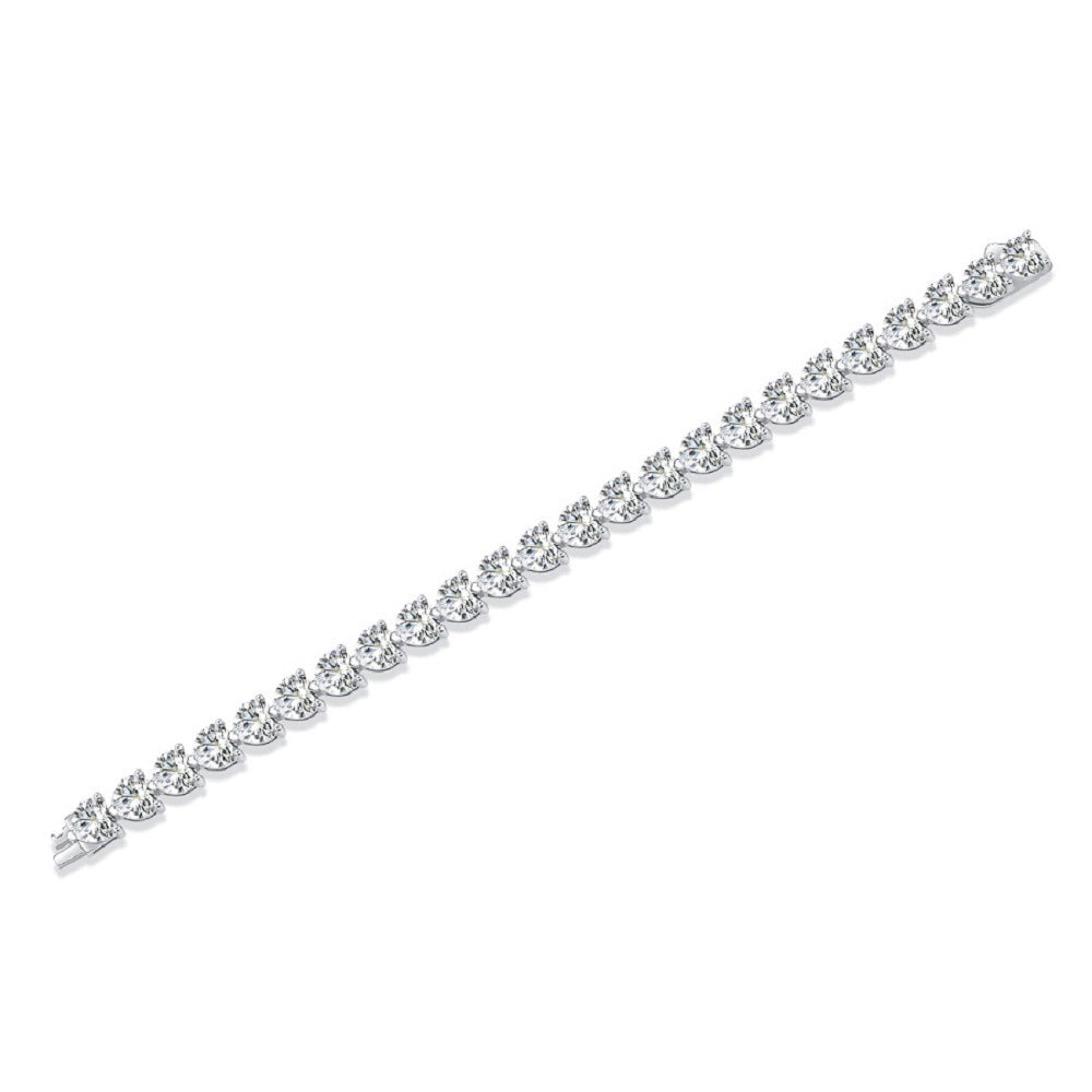 Bracelet styled with romantic or Valentine's accents. Alt: “Wear Your Heart: Styling Heart Cut Moissanite Bracelet.”