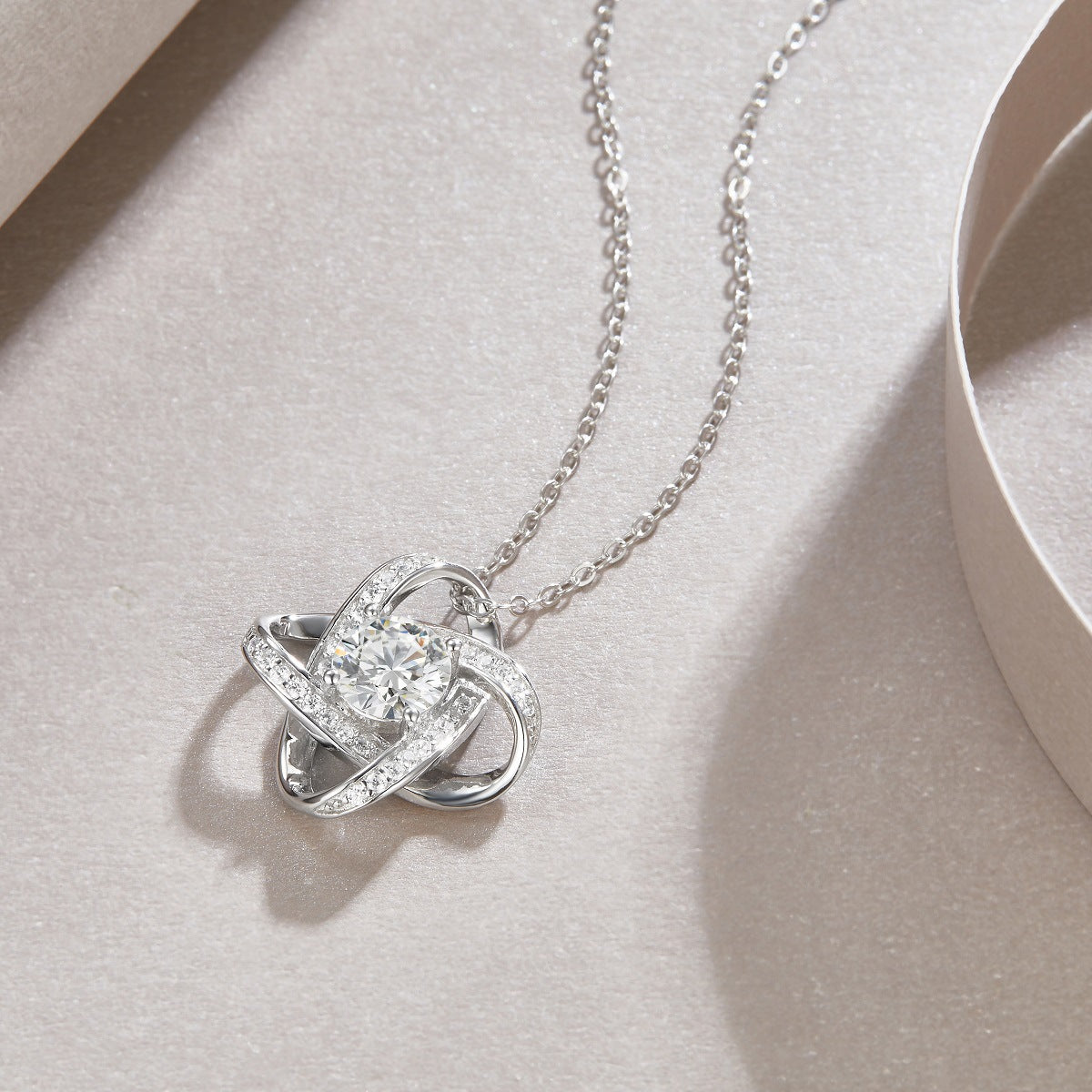 High-definition shot of the necklace laid flat on pure white background.
