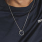 “Male model wearing minimalist Möbius infinity pendant silver necklace”