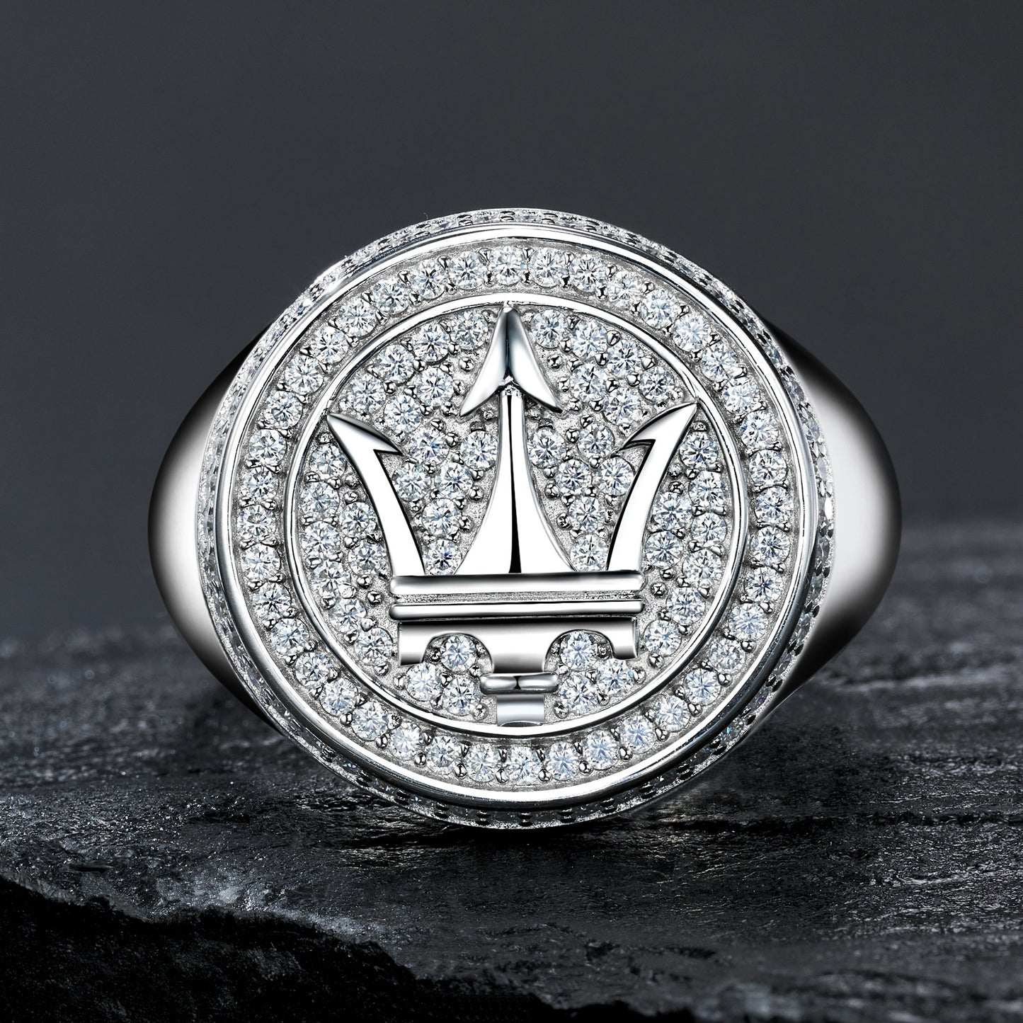 Extreme close-up of the signet top showing the precision of the Maserati trident logo.