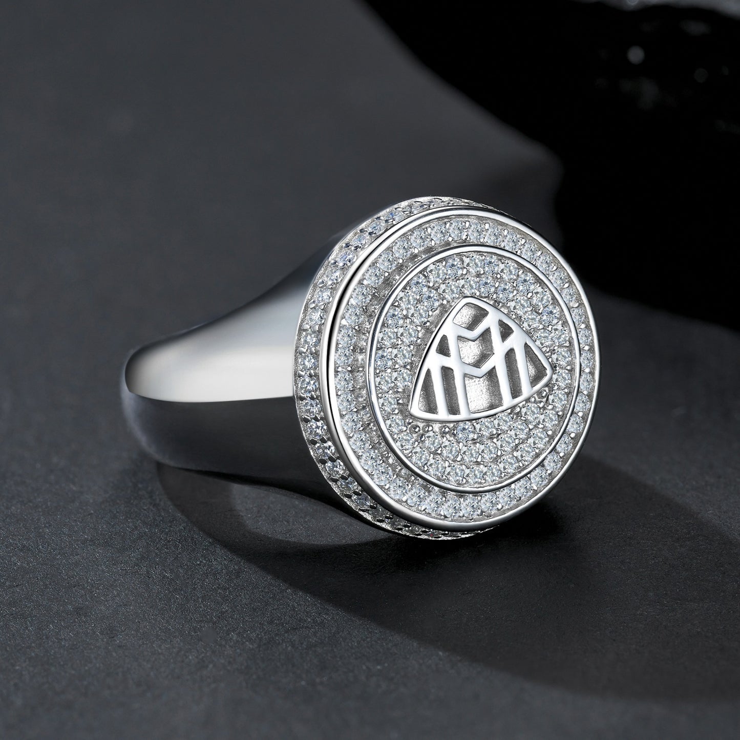 Extreme close-up of the signet top showing the precision of the Maybach logo.