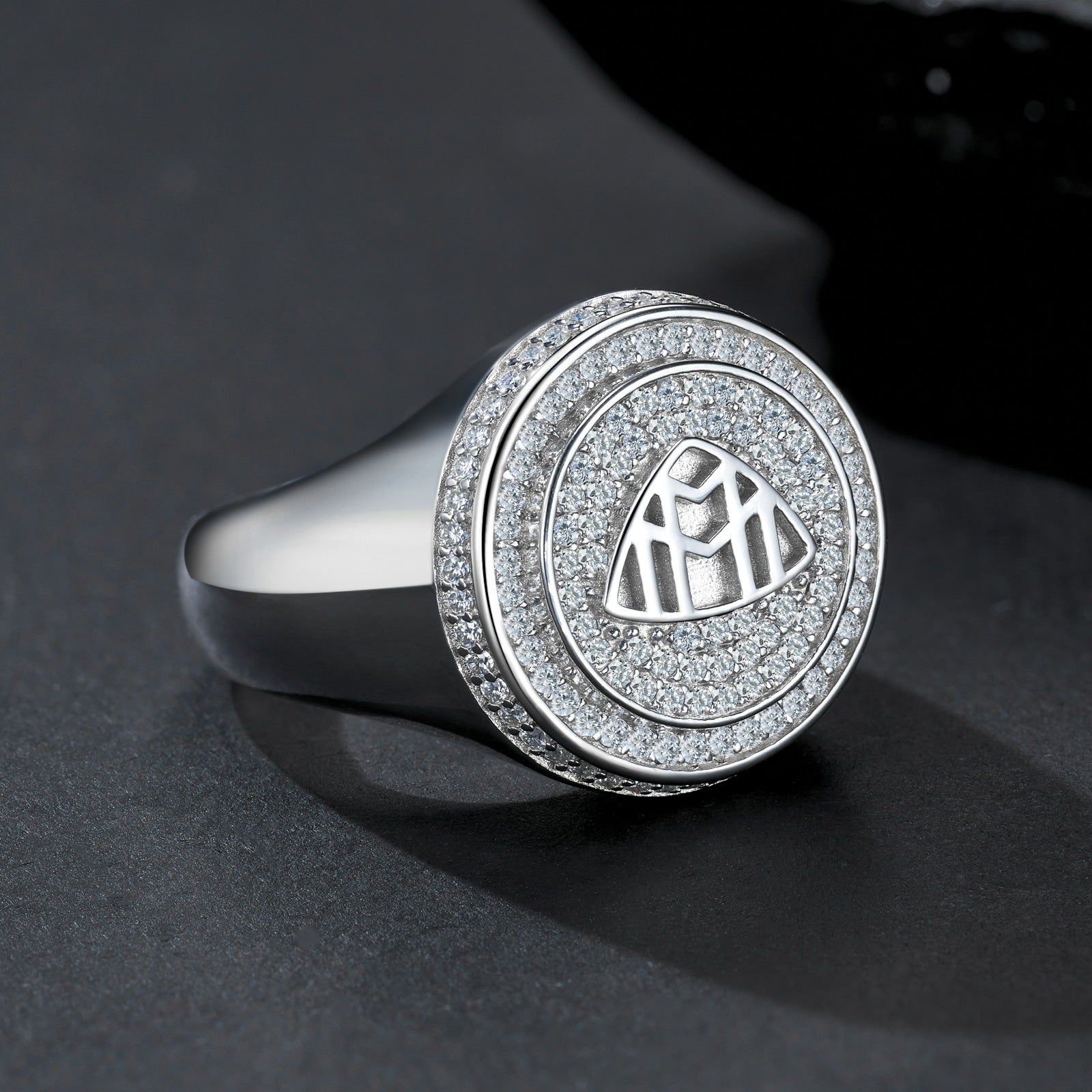 Extreme close-up of the signet top showing the precision of the Maybach logo.