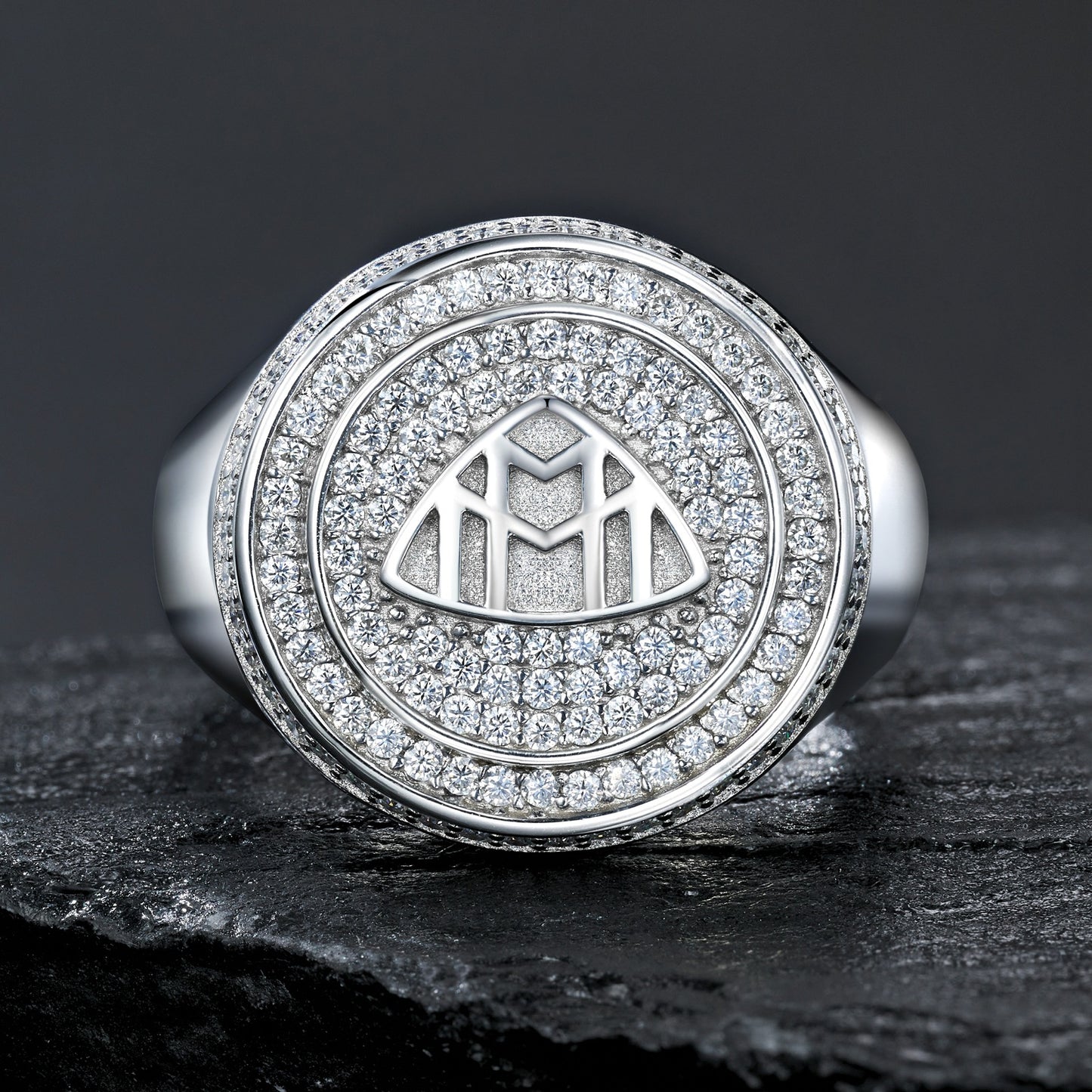 Extreme close-up of the signet top showing the precision of the Maybach logo.