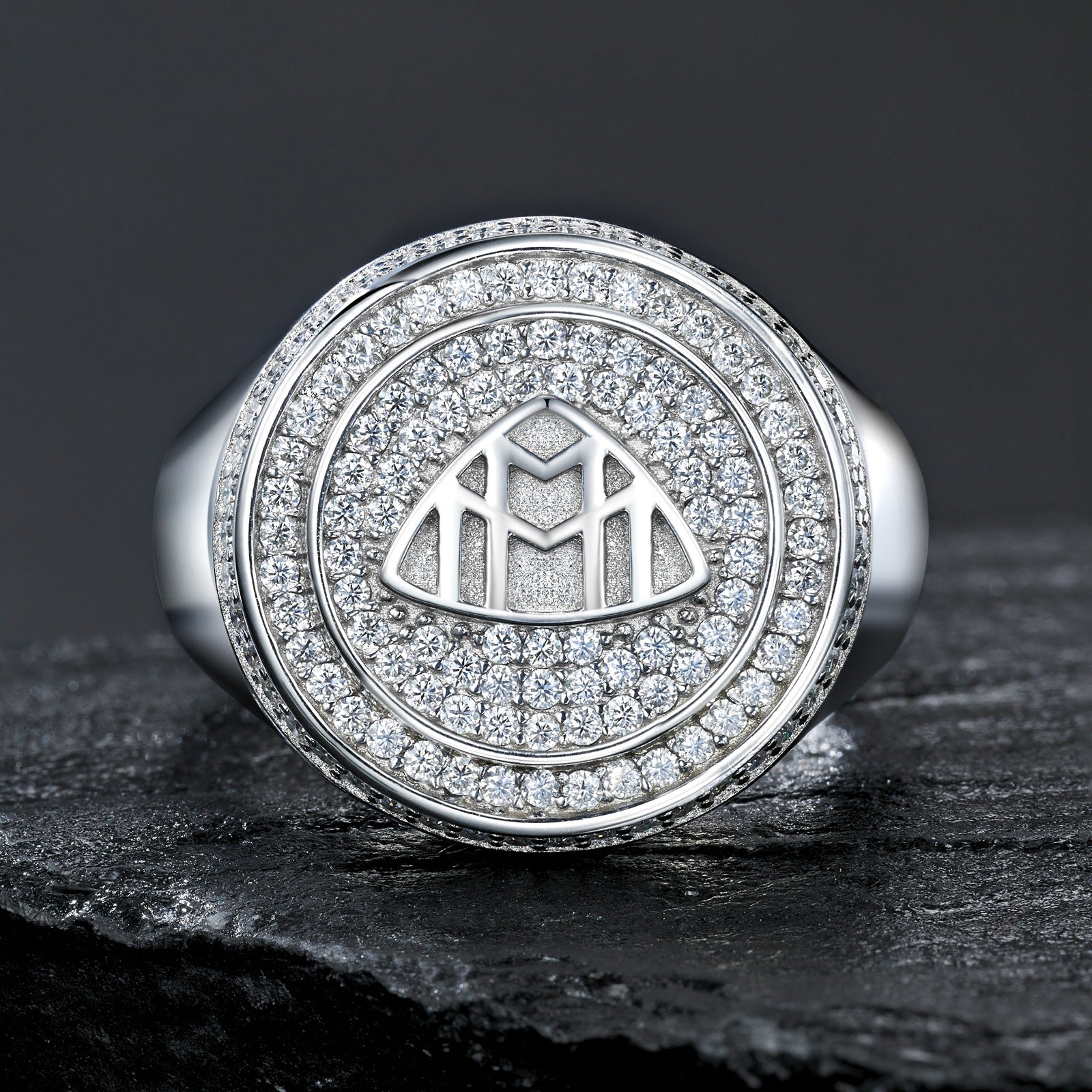 Extreme close-up of the signet top showing the precision of the Maybach logo.