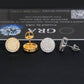 Gold moissanite studs on neutral background. Alt: “18K Gold Moissanite Round Earrings – 925 Silver Unisex.”