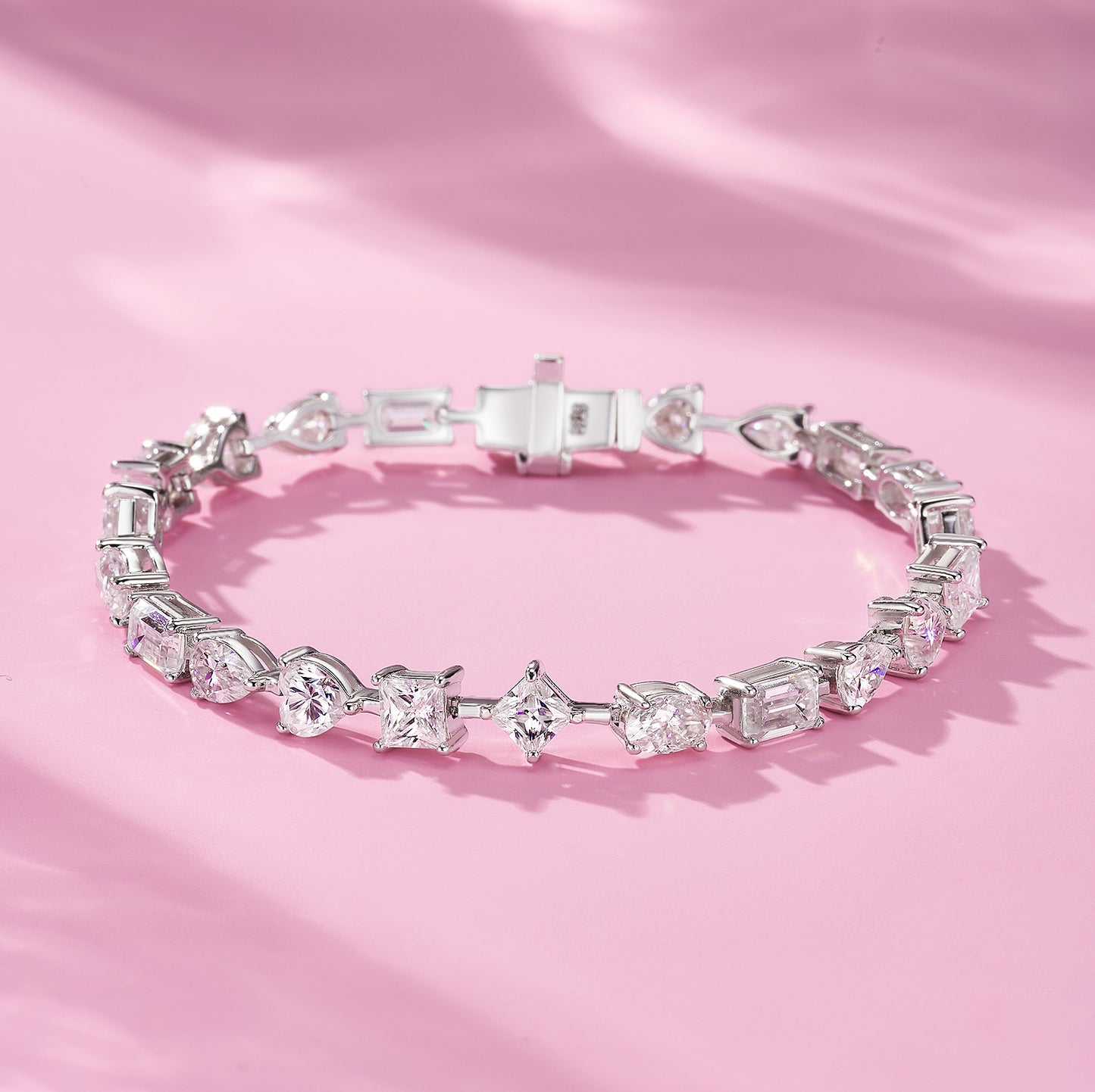 Elegant flat lay featuring 4–5 multi-shape bracelets on neutral backdrop with varied cut illustrations. Alt: “925 Sterling Silver Multi-Shape Moissanite Tennis Bracelets Collection.”