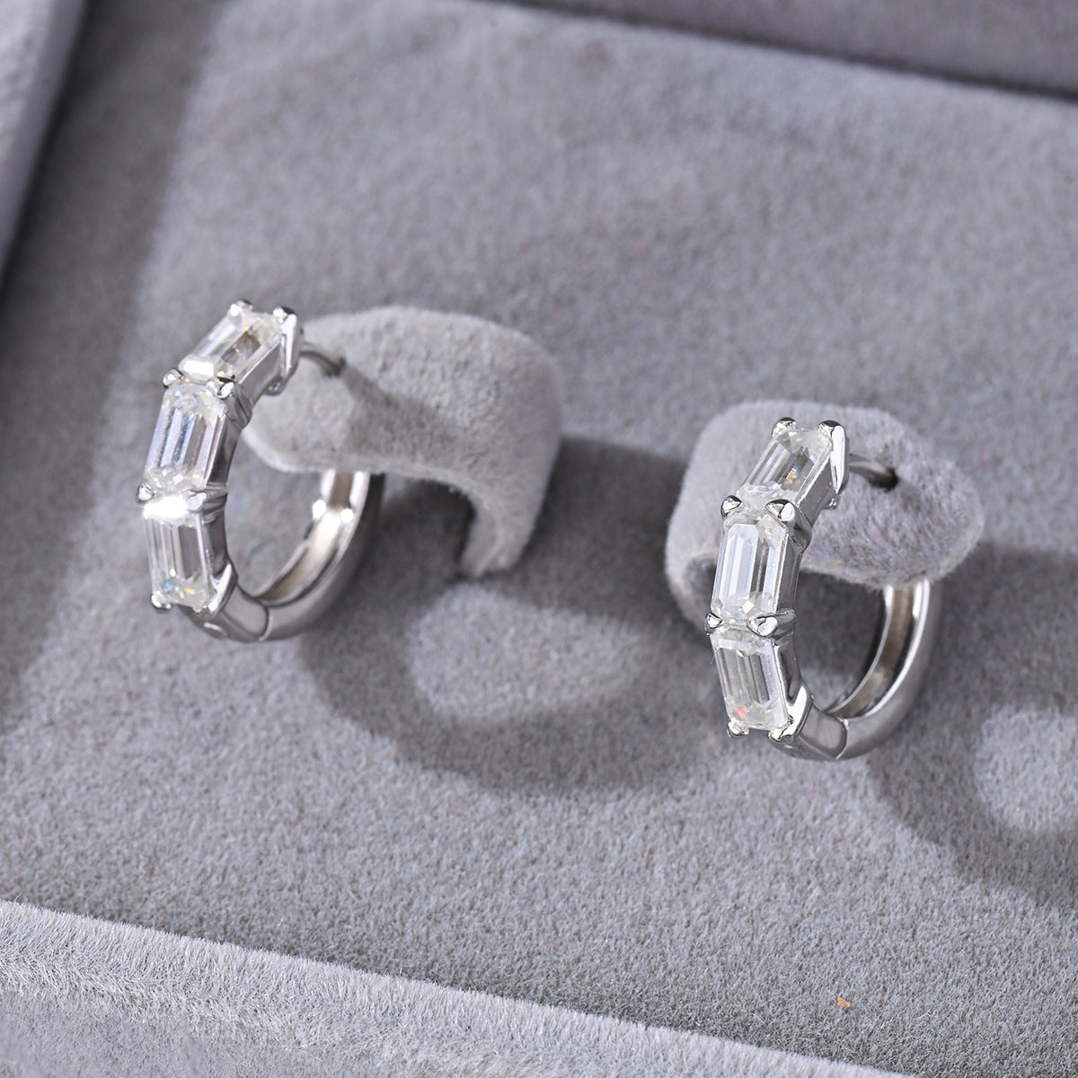 Yellow gold 1.5ct emerald moissanite studs on neutral background. Alt: “1.5ct Emerald Cut Moissanite Earrings – 18K Yellow Gold.”
