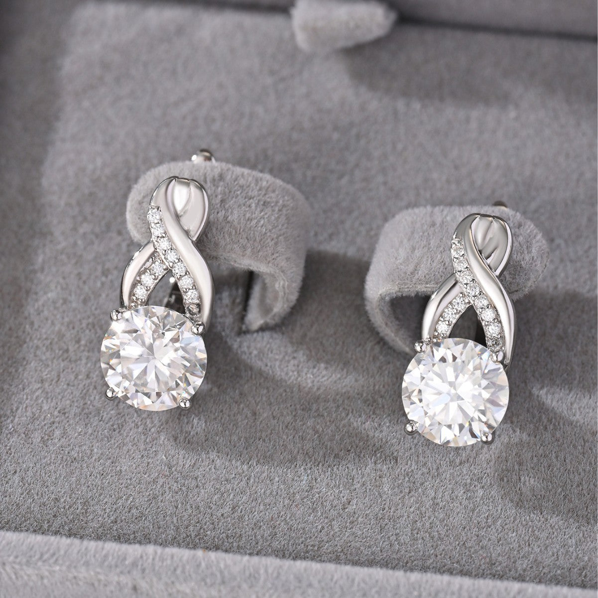  Yellow gold 10mm infinity moissanite studs on neutral background. Alt: “10mm Pavé Infinity Moissanite Earrings – 18K Yellow Gold.”