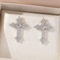 Yellow gold cross moissanite hoops on neutral background. Alt: “Pavé Moissanite Cross Hoops – 18K Yellow Gold.”