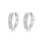 Yellow gold 15mm round pavé hoops on neutral background. Alt: “15mm Round Pavé Moissanite Hoops – 18K Yellow Gold.”
