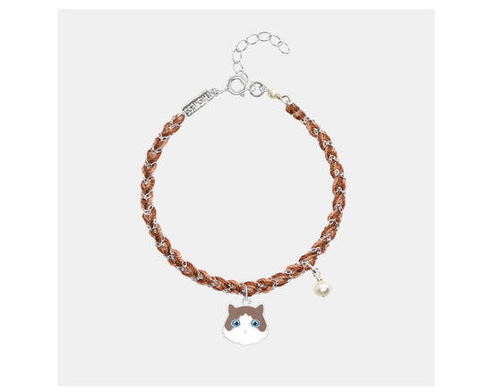 Bracelet with a cat-shaped charm on a white background
