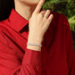 Bracelet worn as geometric statement. Alt: “Modern Sparkle: Square Moissanite Bracelet.”