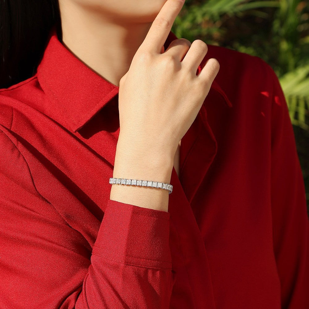 Bracelet worn as geometric statement. Alt: “Modern Sparkle: Square Moissanite Bracelet.”
