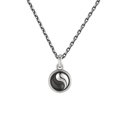Necklace with a yin yang pendant on a white background