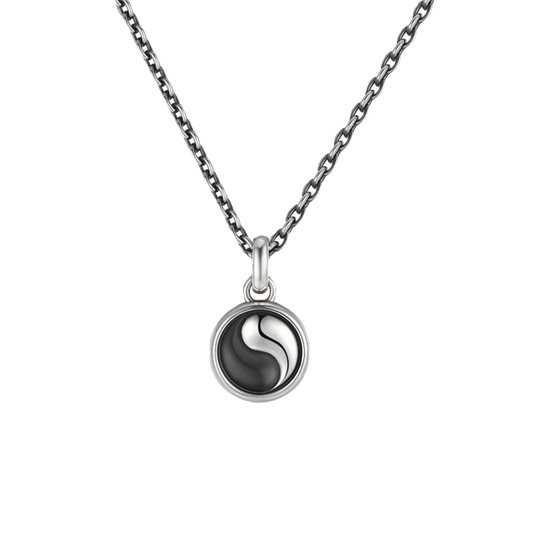 Necklace with a yin yang pendant on a white background