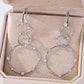 Yellow gold 20mm star drop earrings on neutral background. Alt: “20mm Star Moissanite Drop Earrings – 18K Yellow Gold.”

