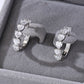 Yellow gold 8mm heart moissanite studs on neutral background. Alt: “8mm Heart Moissanite Earrings – 18K Yellow Gold.”